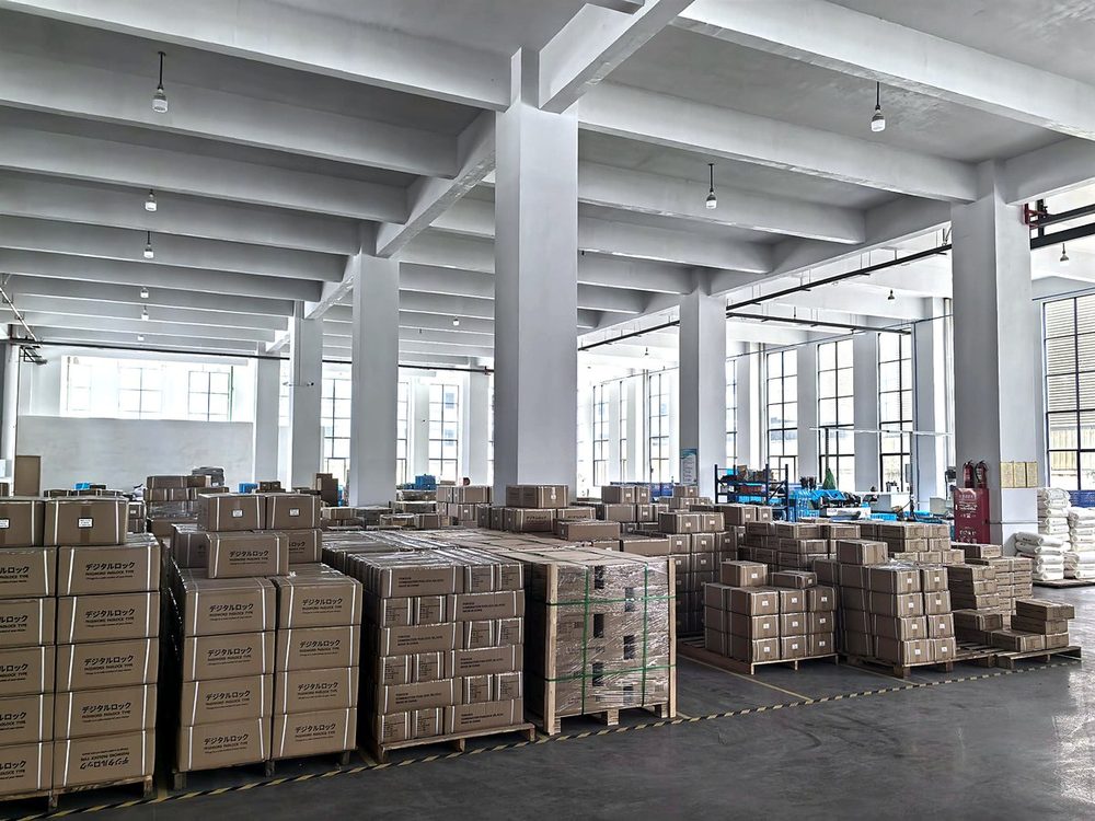 WellLock finished goods warehouse — cartons of padlocks and T handle locks ready for export, Ningbo China