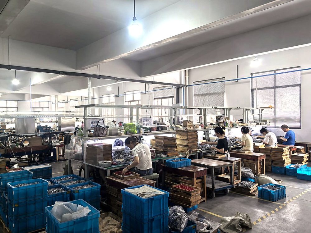 WellLock padlock production workshop — workers assembling locks on the production line, Ningbo China